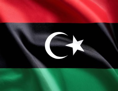 Libya bayrağı rüzgarda sallanıyor. Libya bayrağını yakın çekin, yumuşak ve pürüzsüz ipek. Kumaş kumaş dokusu Asteğmen arkaplan