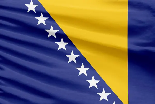 ボスニアとヘルツェゴビナの旗は 折り目のあるスポーツステッチの布地に描かれています — ストック写真