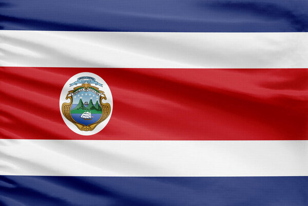 Флаг Коморских островов изображен на спортивной ткани со складками.