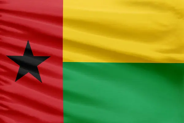 Флаг Гвинеи Бисау Изображен Ткани Спортивного Стежка Складками — стоковое фото
