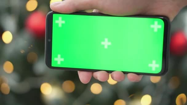 Ręczne Trzymanie Smartfona Zielonym Ekranem Kluczu Chroma Uroczysta Zima Nowy — Wideo stockowe
