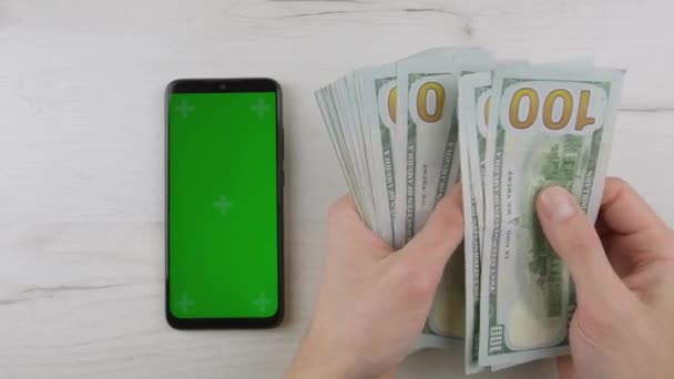 Smartphone Green Blue Screen Man Counting Dollars Cash Paper Money — Videoclip de stoc