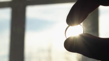 Human hand on background of sun. Backlight silhouette sunlight at sunset sunrise. The concept of love, dream, religion, faith in god, prayer, meditation. Christian Muslim raises his hands to the sky.
