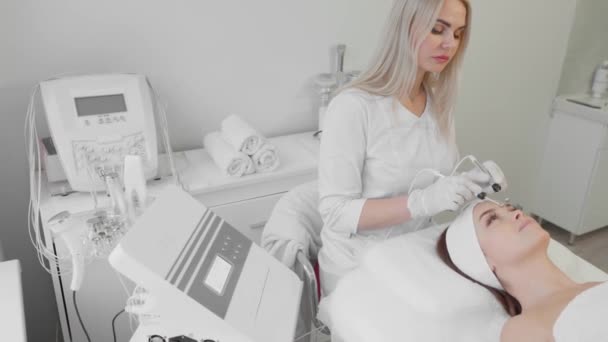 Beautiful Woman Receives Microcurrent Facial Skin Treatment Cosmetologist Spa Salon — Video