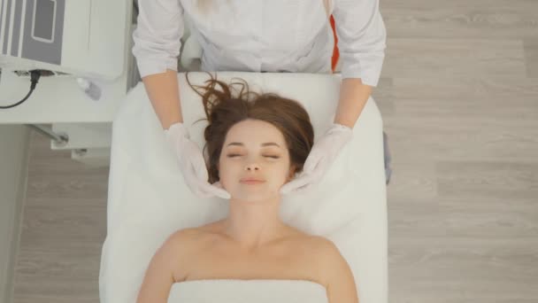 Woman Beautician Applies Cream Face Massage Care Relaxation Rejuvenation Nourishment — Stockvideo