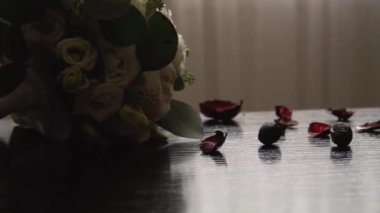 Wedding bouquet close-up. Decoration of roses and ornamental plants close-up. Traditional wedding decoration and holiday element. Flowers and decoration to order. Selective focus.