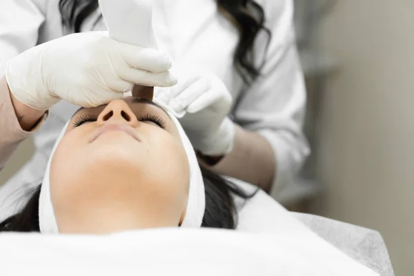 Individual approach to the skin: a professional cosmetologist takes into account the unique needs of the patients skin, using ultrasonic facial cleansing as an individual approach to facial skin care