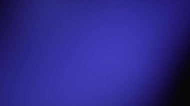 This captivating video offers an abstract play of light, creating a magical blur effect, adding beauty and mystery to the visual design. Blue and purple on black background. High quality 4k footage