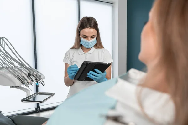 The patient provides the dentist with complete information about his complaints about dental health. The patient learns about the recommended treatment plan and possible methods of correcting the