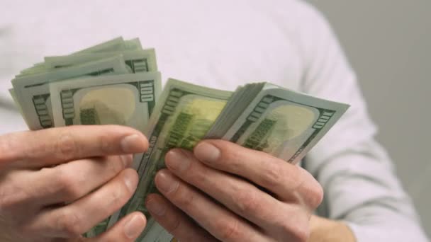 Man His Hands Holds Pack Hundred Dollar Bills Counts Them — Stock Video