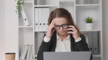 Business woman worried, listening to sad, bad news on the phone. Negative emotions. Head of Finance, carefully studying reports and analyzing the economic performance of her company. High quality 4k