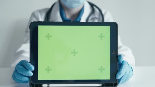 Doctor Emphasizes Importance Medical Services Demonstration Green Tablet Screen Clinics — Stock Video