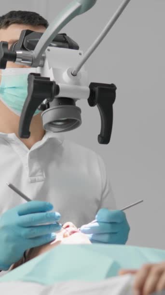 Tooth Extraction Procedure Doctor Uses Microscope Precisely Cut Remove Root — Stock Video
