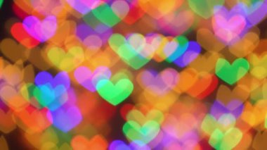 Canlı renklerde kalp şeklindeki Bokeh ışıklarının büyüleyici bir gösterisi romantik bir atmosfer yaratır. Sevgililer Günü 'nde aşkı kutlamak ve sevdiklerimizle unutulmaz anılar yaratmak için idealdir.
