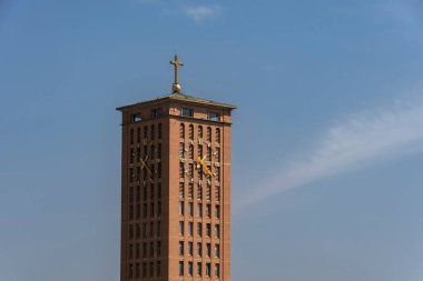 Aparecida, Brazil. Clock tower of the Cathedral Basilica of Nossa Senhora Aparecida, national sanctuary. Background blue sky clipart