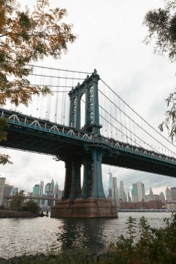 Hudson river with Manhattan bridge and modern skyscrapers of New York City on background