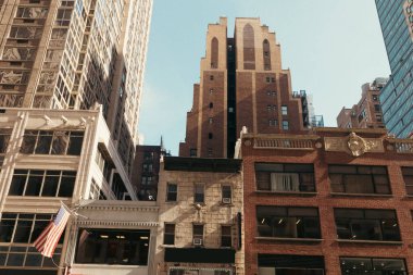 national usa flag on stone building in Manhattan borough of New York 