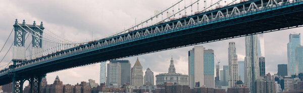 scenic view of skyscrapers and Manhattan bridge in New York City, banner