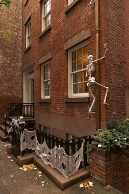 Halloween decoration on facade of building on street in New York City