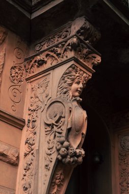 Sculpture on facade of building in street in New York City