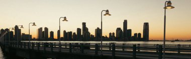 Lanterns on bridge and Hudson river in New York City, banner 
