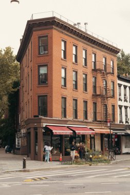 NEW YORK, USA- OCTOBER 11, 2022: Brick building on urban street at daytime 