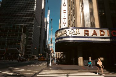 NEW YORK, USA - OCTOBER 11, 2022: Music radio hall and Rockefeller center on urban street 
