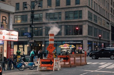 NEW YORK, USA - OCTOBER 11, 2022: Safety sign on road on urban street in Manhattan 