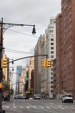 Traffic lights above road on urban street in Manhattan 