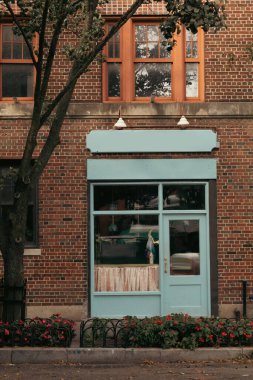 Shop entrance inside of brick building on street in Manhattan 