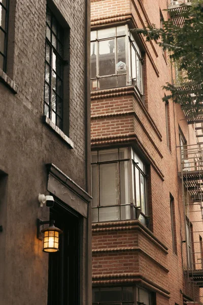 stock image stone buildings with glazed balconies and lantern on New York City street