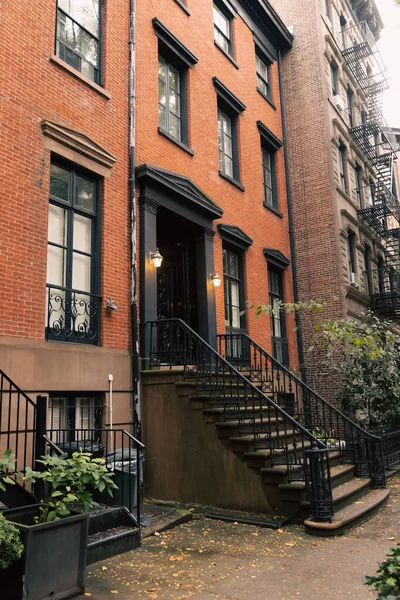 Lanterns near entrance of house on street in New York City