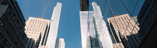 Low angle view of Central park tower with blue sky at background in New York City, banner 