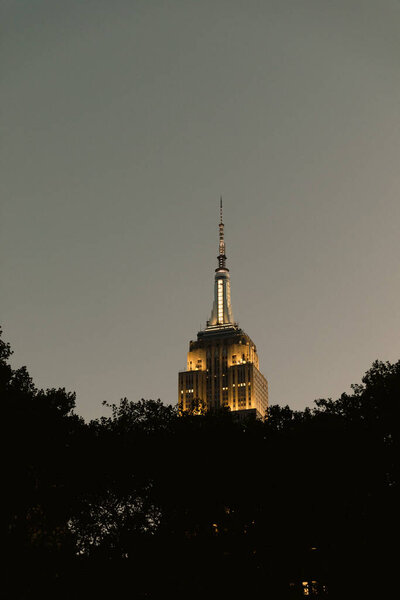 Empire state building with lighting during evening in New York City