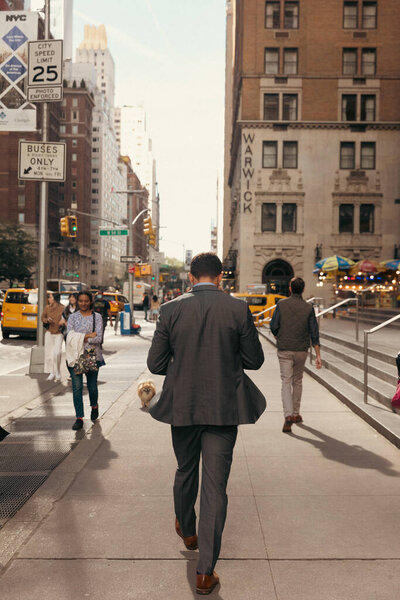 NEW YORK, USA - OCTOBER 11, 2022: People walking on urban street in Manhattan 