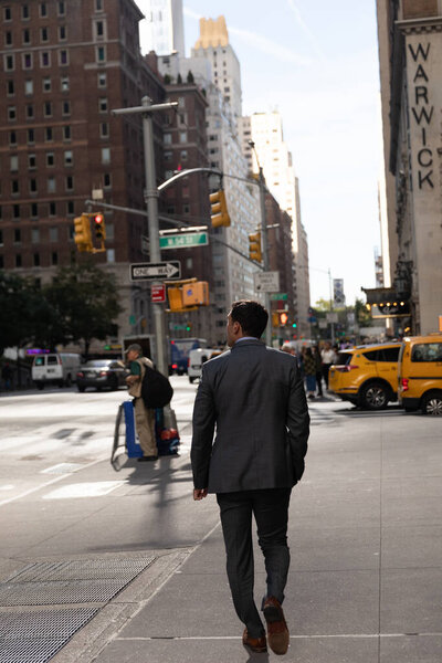NEW YORK, USA - OCTOBER 11, 2022: Man walking on blurred urban street in Manhattan 