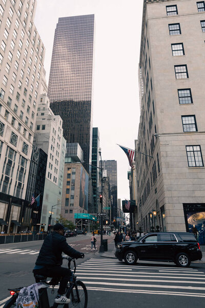 NEW YORK, USA - OCTOBER 11, 2022: American flag on facade of building on urban street in Manhattan 