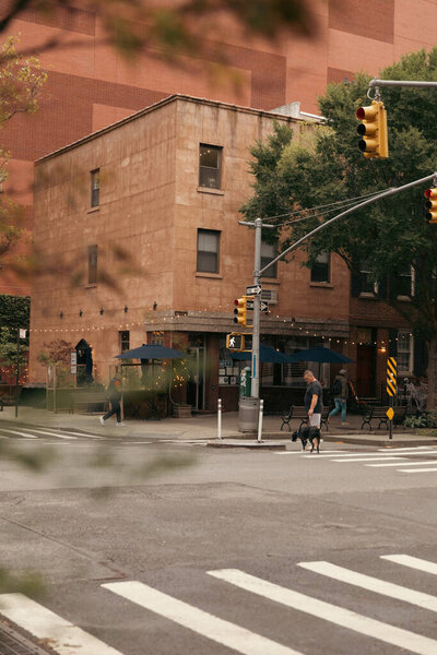 NEW YORK, USA - OCTOBER 11, 2022: People walking on urban street at daytime in Manhattan 