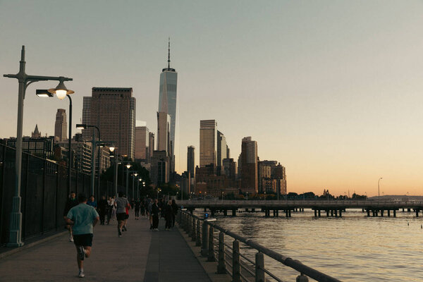 NEW YORK, USA - OCTOBER 11, 2022: Word Trade Center and bridge in evening 