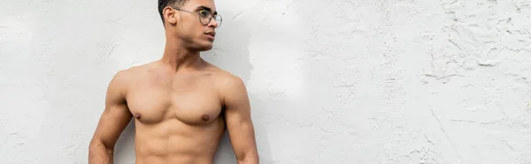 stock image Sexy and muscular young cuban man in stylish round-shaped eyeglasses, banner 