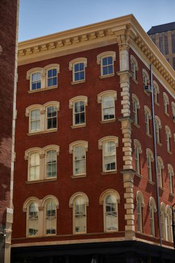 corner of red vintage building with stucco decor in downtown district of new york city, streetscape clipart