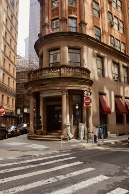 corner building with stone balustrade on balcony in downtown of new york city, vintage architecture clipart