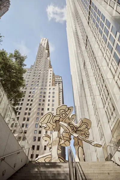 stock image low angle view of creative art installation near stairs and skyscrapers in new york, street scene