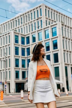 A woman in a stylish outfit walks confidently in a European city. clipart