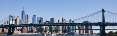 A view of the Manhattan Bridge and the New York City skyline. clipart