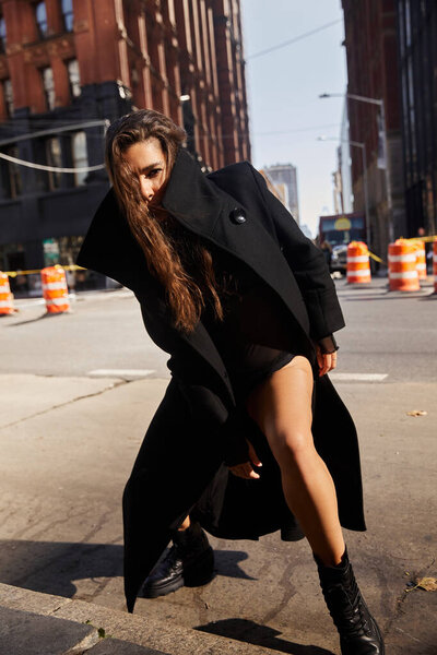 Young woman effortlessly dances through NYC streets.