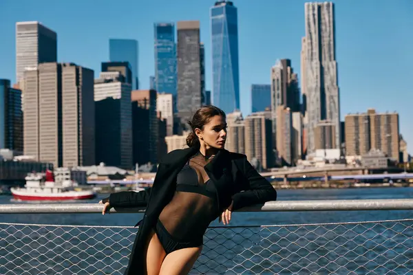 stock image A woman dances in front of the New York City skyline.