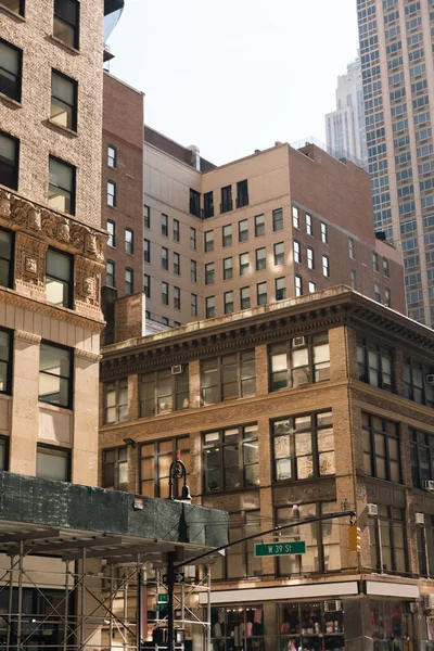 Different stone and concrete buildings on urban street in New York City — стокове фото