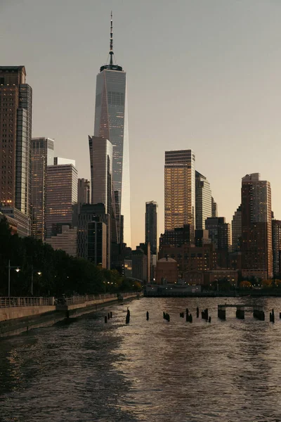 Skyscraper and buildings of World Trade Center during sunset in New York City — Stock Photo