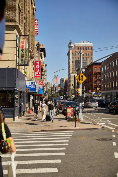NEW YORK, USA - NOVEMBER 26, 2022: pedestrians walking along busy street in asiatown — Stock Photo